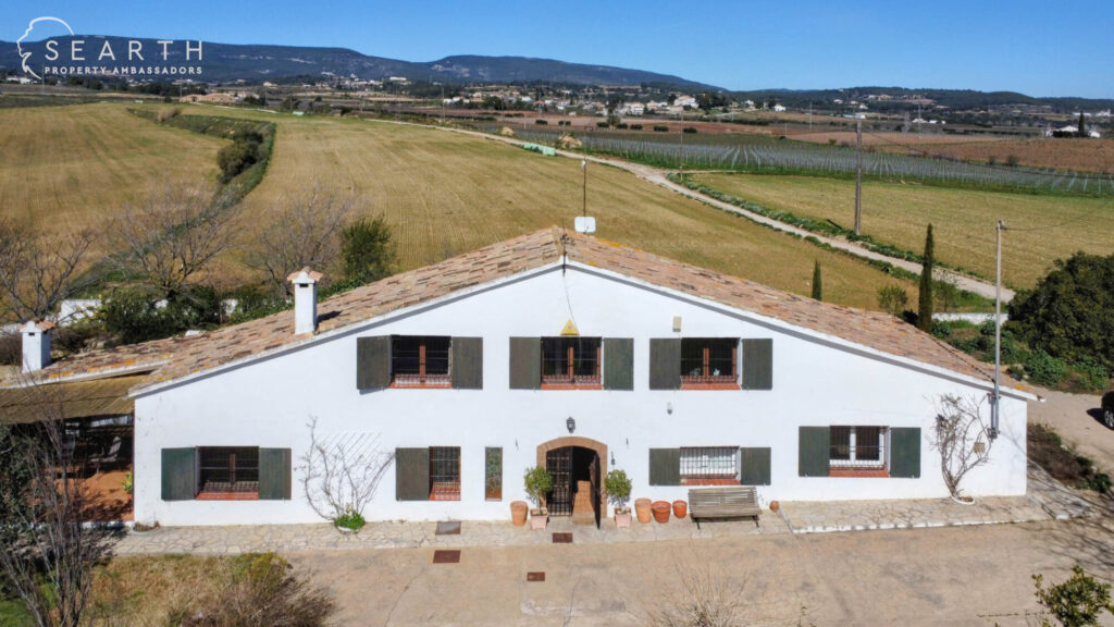 Catalan masia surrounded by vineyards